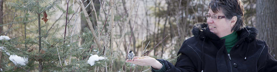 Cindy Crowe with a chickadee